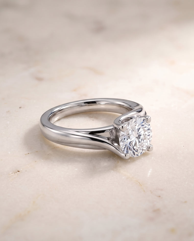 The Joplin Twisted Bypass Solitaire Round Engagement Ring Setting in Platinum