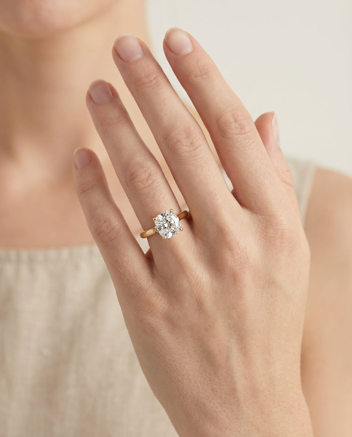 Juliette Select Cathedral Solitaire Cushion Cut Lab Diamond Engagement Ring in 18K Yellow Gold, shown on hand | RockHer
