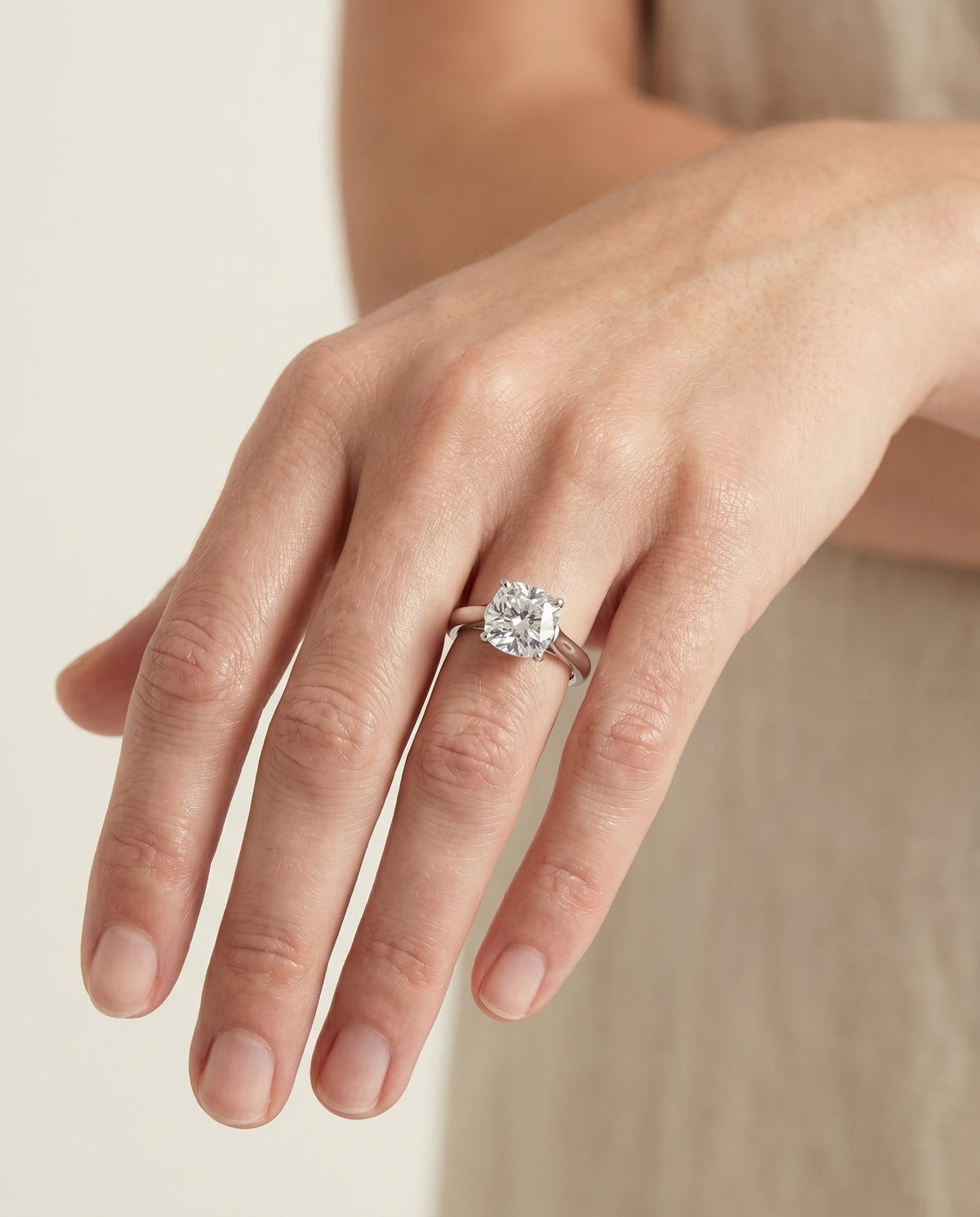 Juliette Select Cathedral Solitaire Cushion Cut Lab Diamond Engagement Ring in 18K White Gold, shown on hand | RockHer