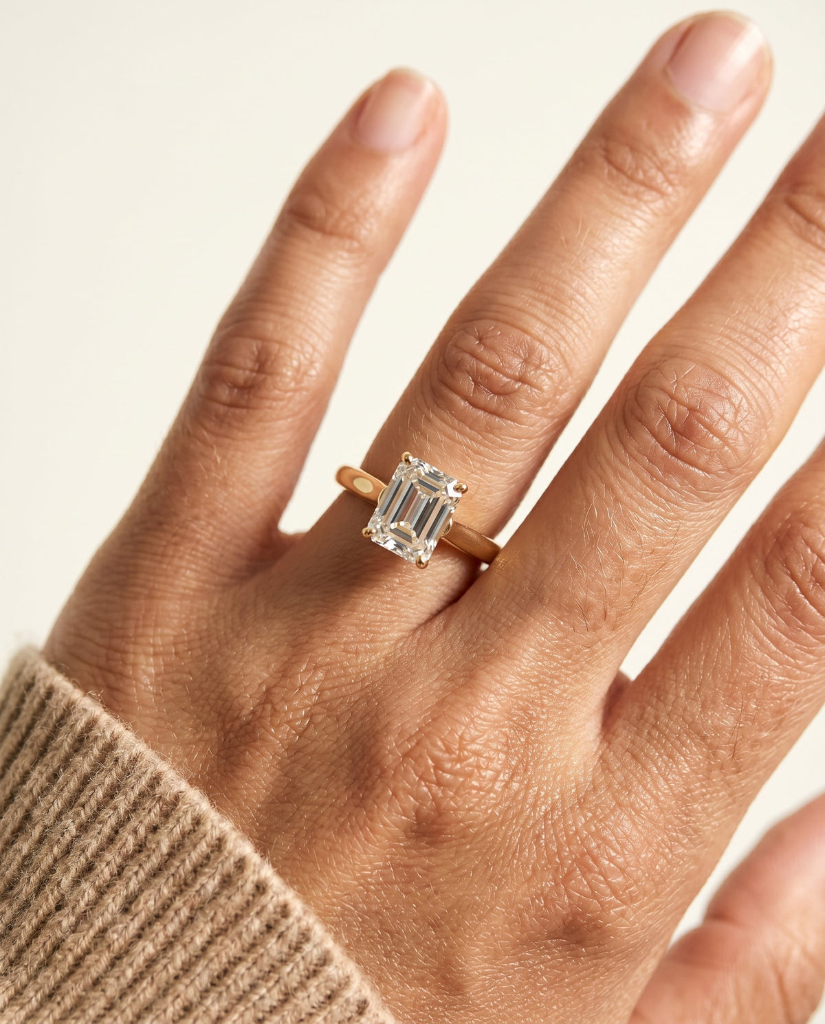Juliette Select Cathedral Solitaire Emerald Cut Lab Diamond Engagement Ring in 18K Yellow Gold, shown on hand | RockHer