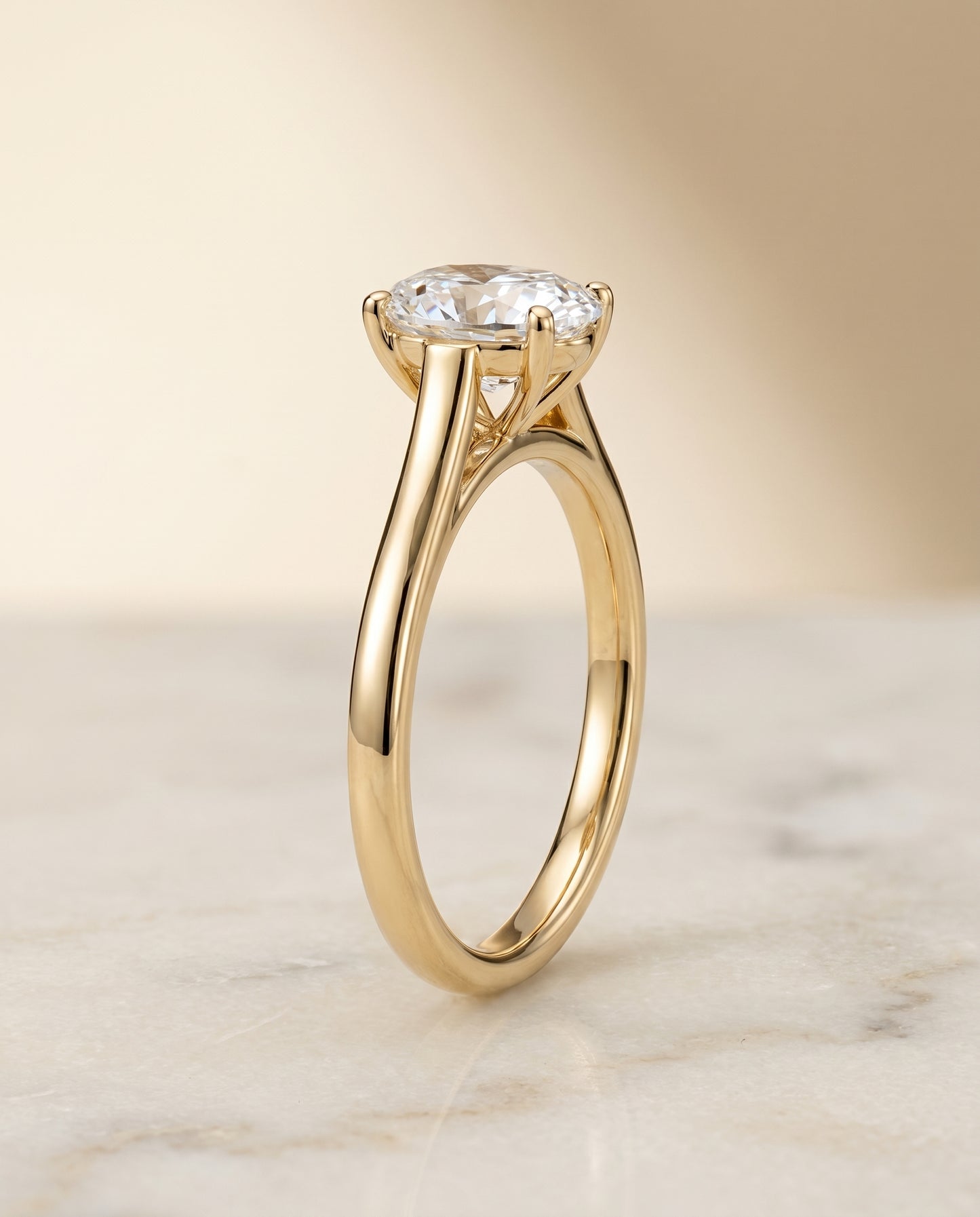 The Juliette Solitaire Engagement Ring Setting for Oval Diamonds in 18K Yellow Gold