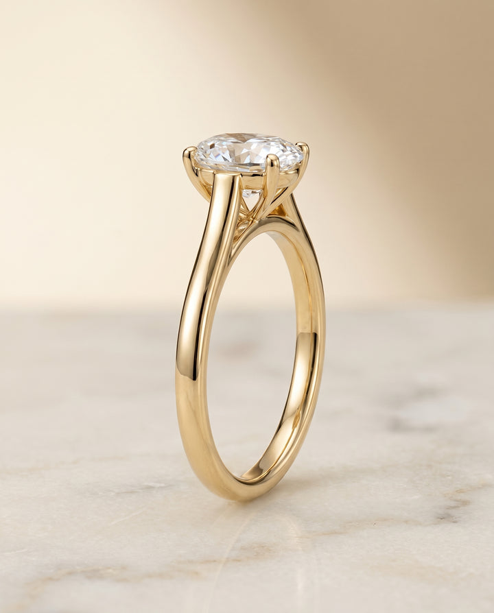 The Juliette Solitaire Engagement Ring Setting for Oval Diamonds in 18K Yellow Gold