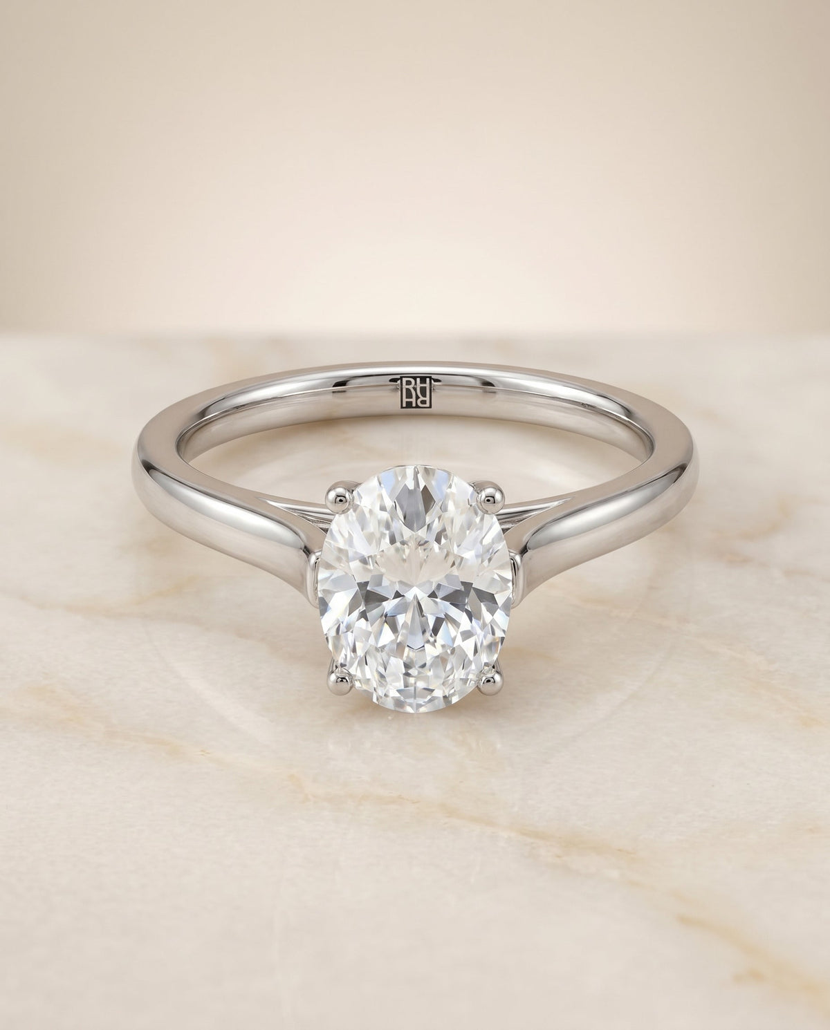 Juliette Select Cathedral Solitaire Oval Lab Diamond Engagement Ring in Platinum, shown on hand, angled | RockHer