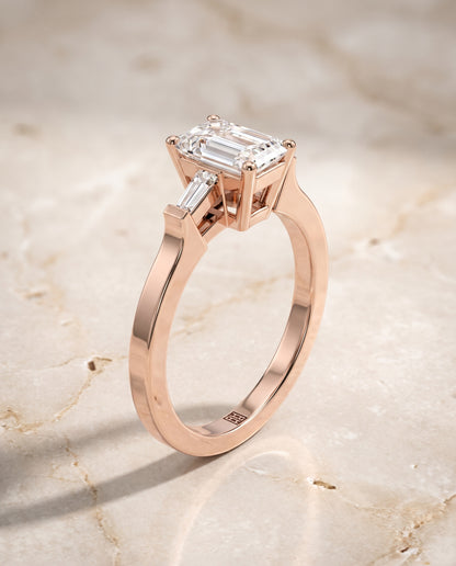 The June Three Stone Emerald Cut Engagement Ring Setting in 14K Rose Gold