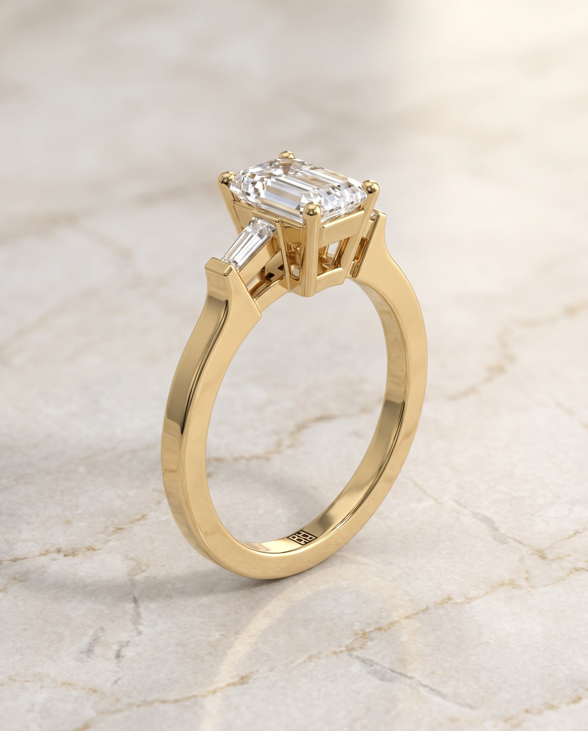 The June Three Stone Emerald Cut Engagement Ring Setting in 18K Yellow Gold