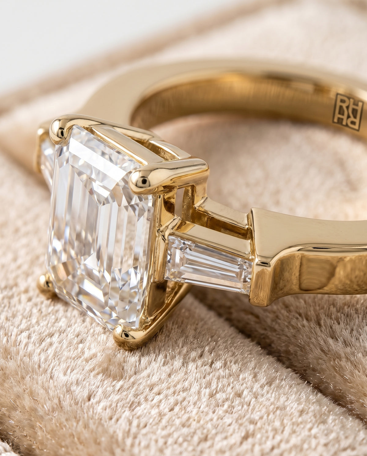 The June Three Stone Emerald Cut Engagement Ring Setting in 18K Yellow Gold