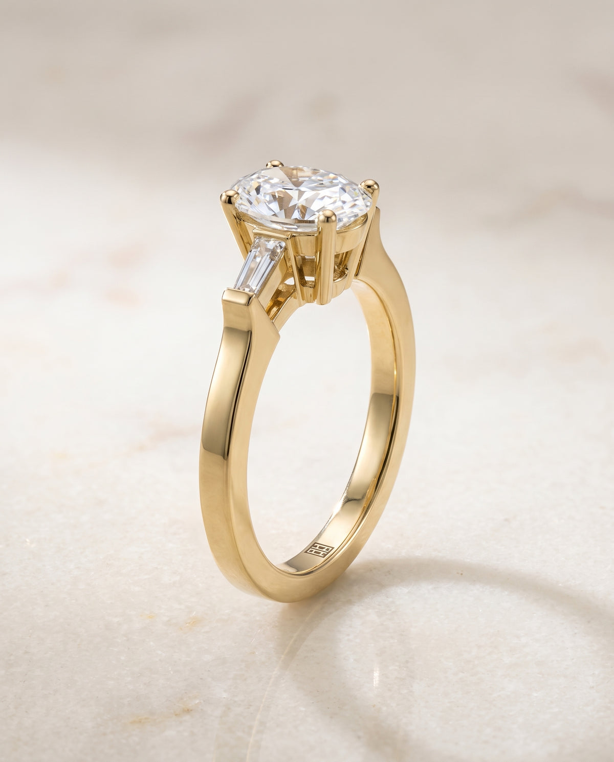 The June Three Stone Oval Engagement Ring Setting in 18K Yellow Gold