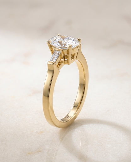 The June Three Stone Oval Engagement Ring Setting in 18K Yellow Gold