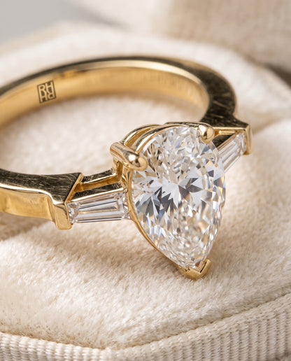 The June Three Stone Pear Engagement Ring Setting in 18K Yellow Gold