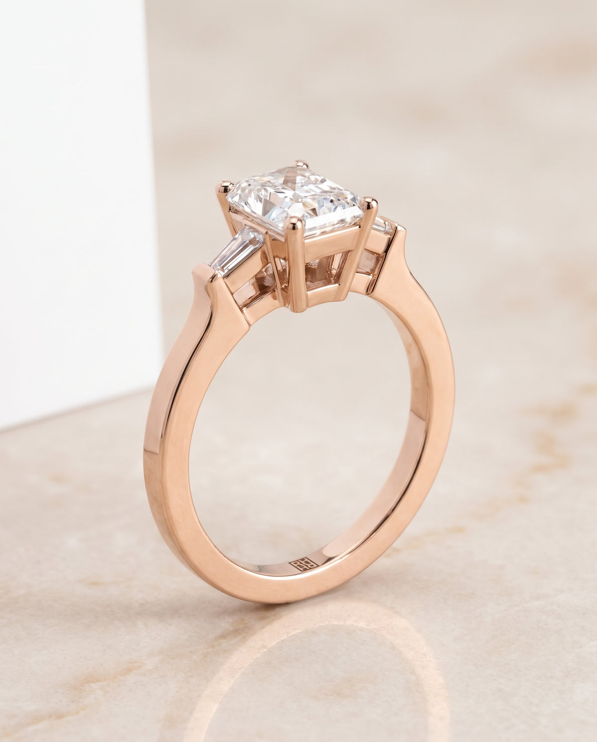 The June Three Stone Radiant Cut Engagement Ring Setting in 14K Rose Gold