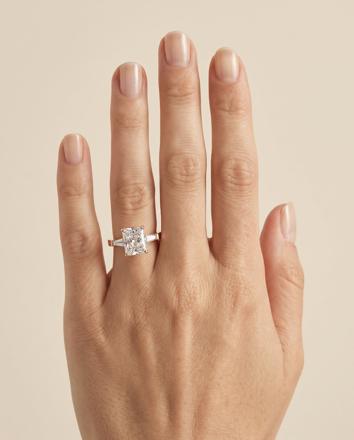 The June Three Stone Radiant Cut Engagement Ring Setting in 14K Rose Gold