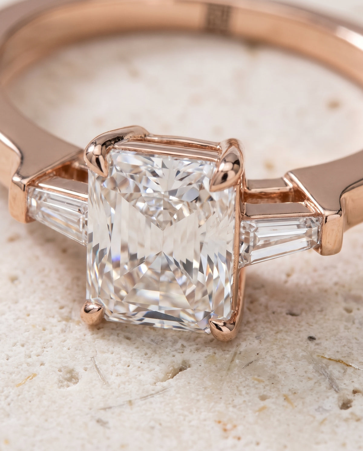 The June Three Stone Radiant Cut Engagement Ring Setting in 14K Rose Gold