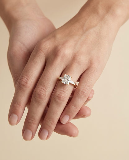 The June Three Stone Radiant Cut Engagement Ring Setting in 18K Yellow Gold