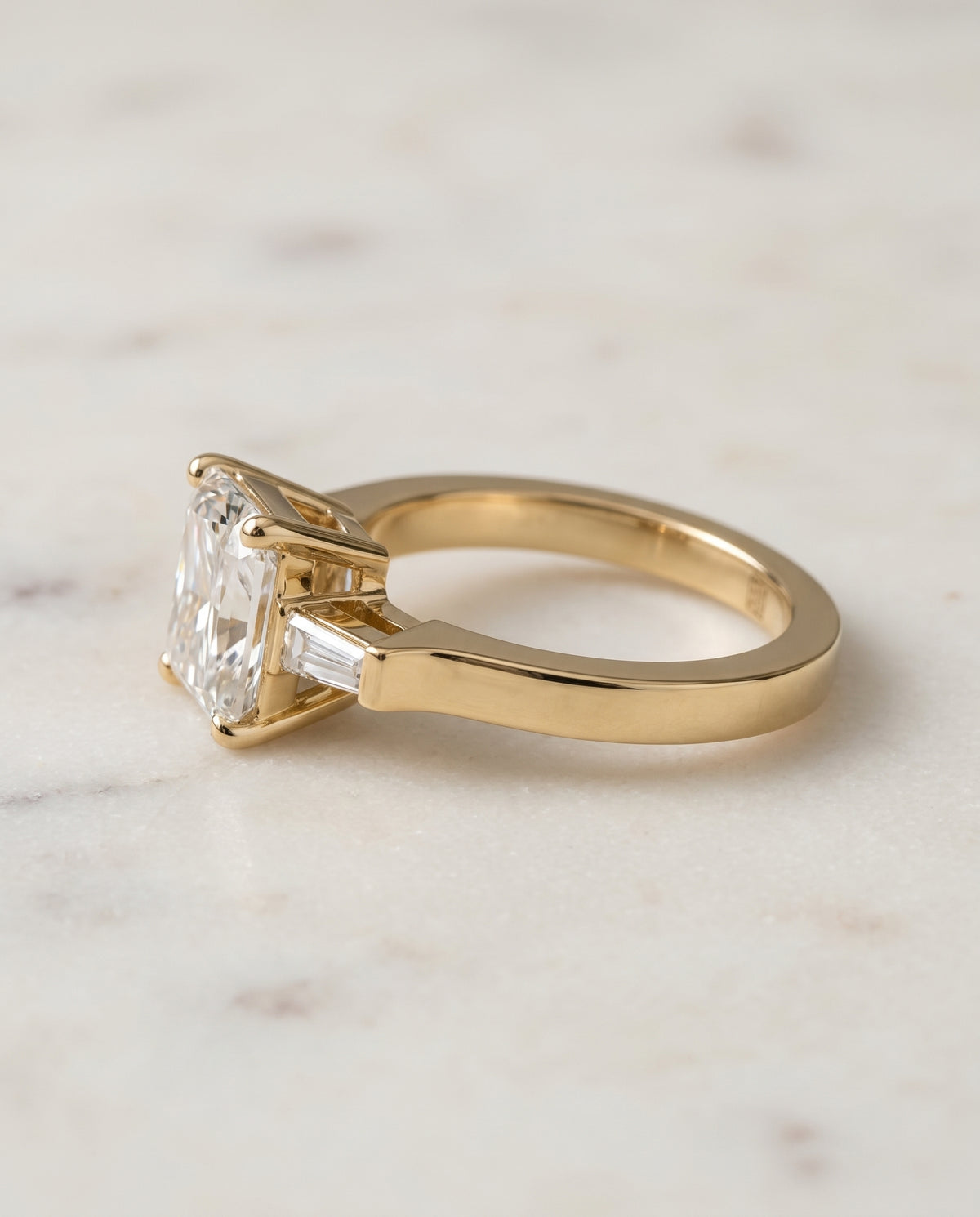 The June Three Stone Radiant Cut Engagement Ring Setting in 18K Yellow Gold