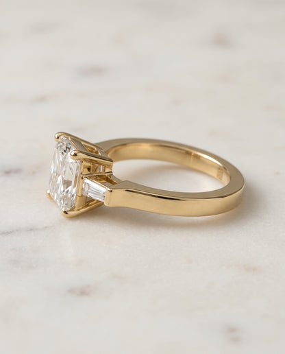The June Three Stone Radiant Cut Engagement Ring Setting in 18K Yellow Gold