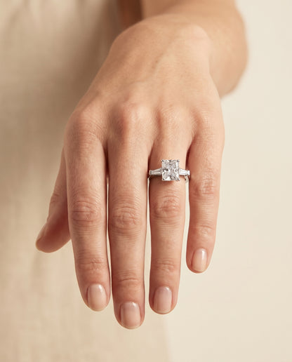 The June Three Stone Radiant Cut Engagement Ring Setting in Platinum
