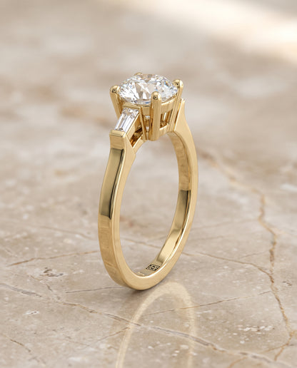 The June Three Stone Round Engagement Ring Setting in 18K Yellow Gold