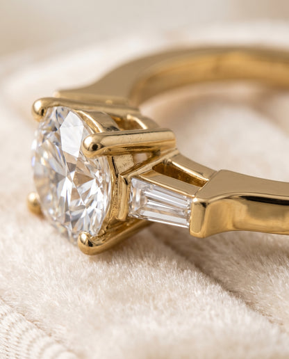 The June Three Stone Round Engagement Ring Setting in 18K Yellow Gold