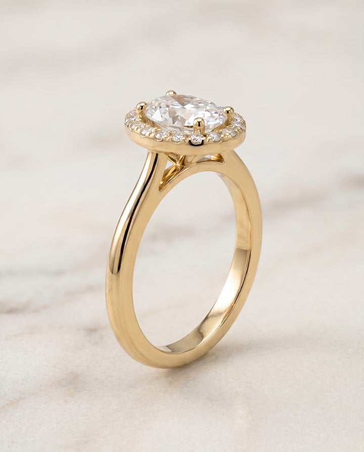 The Kate Pavé Halo Engagement Ring Setting for Oval Diamonds in 18K Yellow Gold