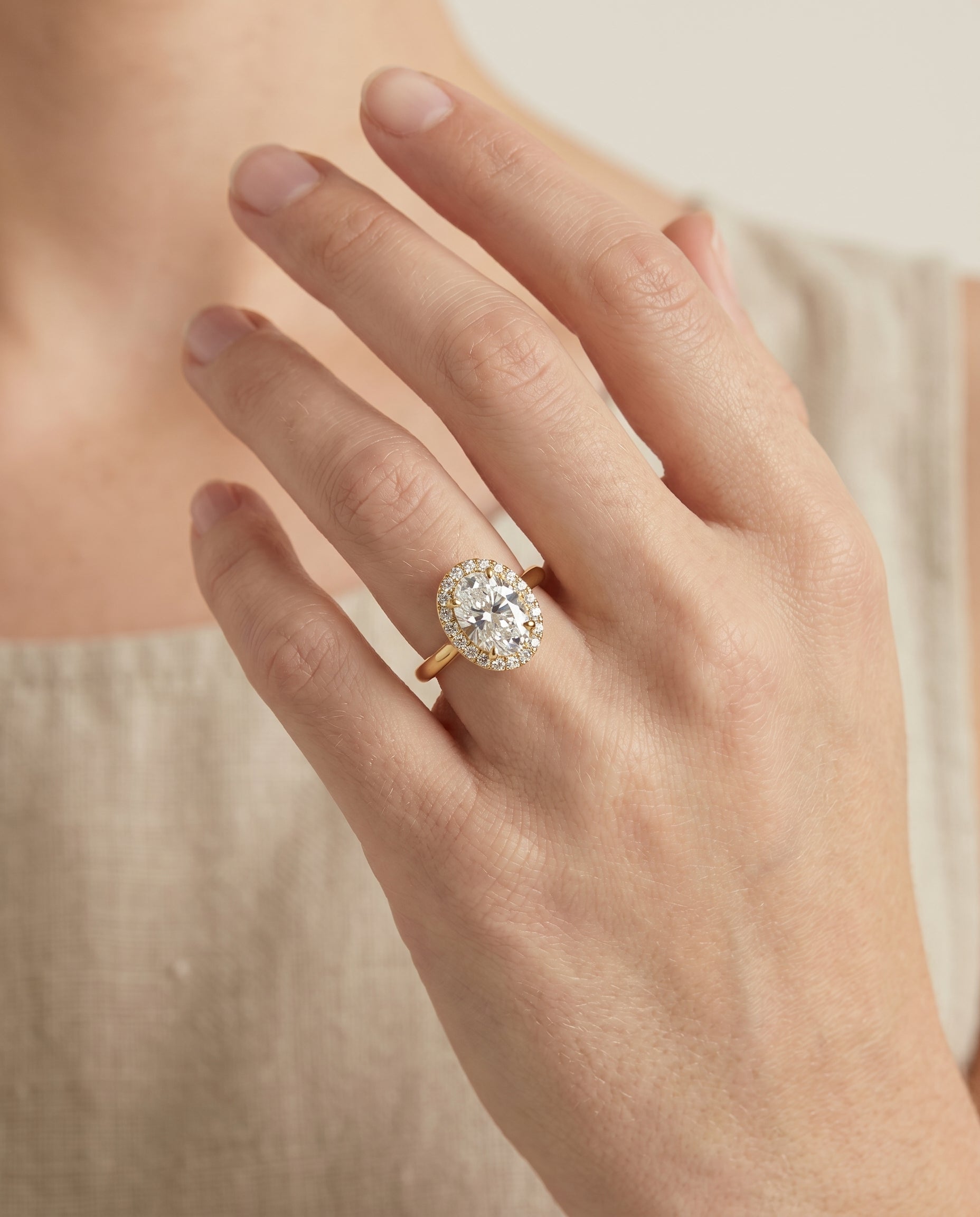 Kate Select Classic French Pavé Halo Oval Lab Diamond Engagement Ring in 18K Yellow Gold, shown on hand | RockHer