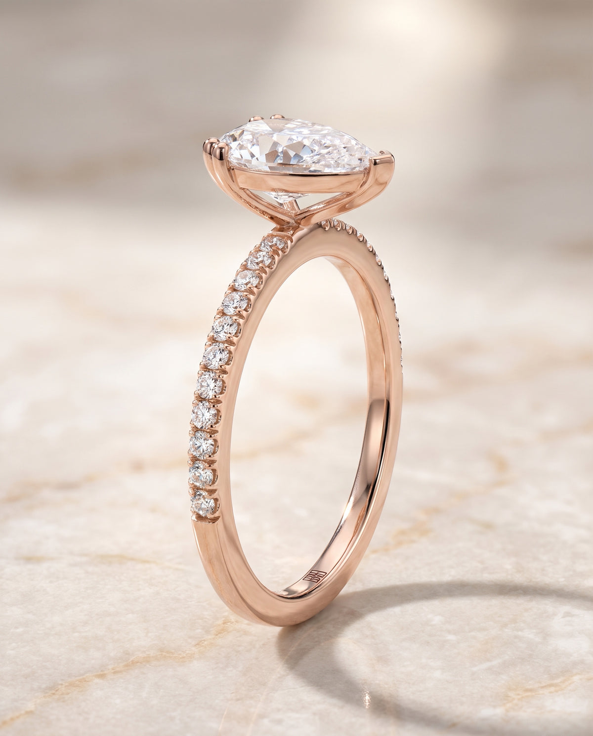 Pear engagement ring setting in 14K Rose Gold, Kelly Double Claw Prong French Pavé Pear, alternate view | RockHer