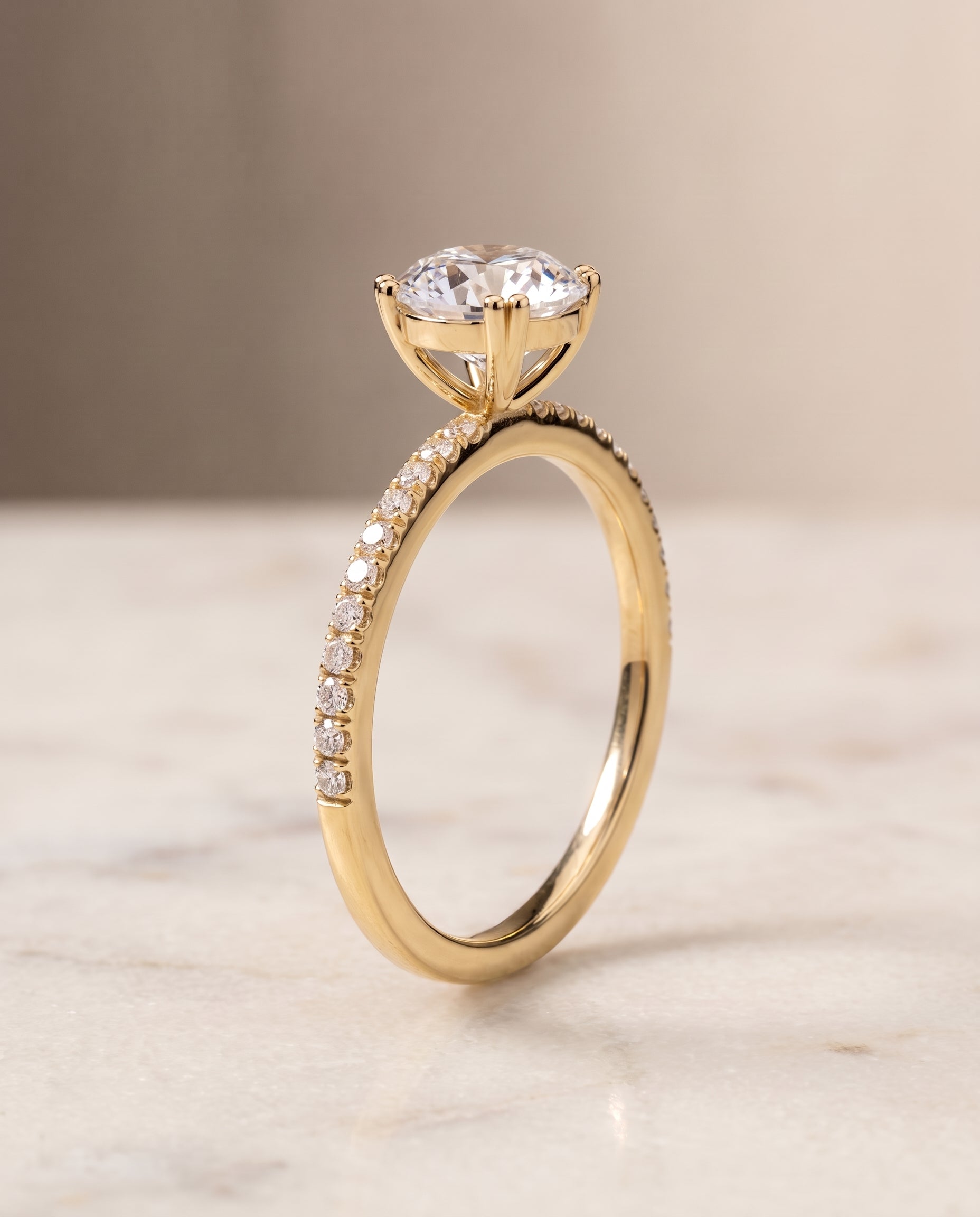 The Kelly setting for round diamonds, made to order in 18K Yellow Gold | RockHer