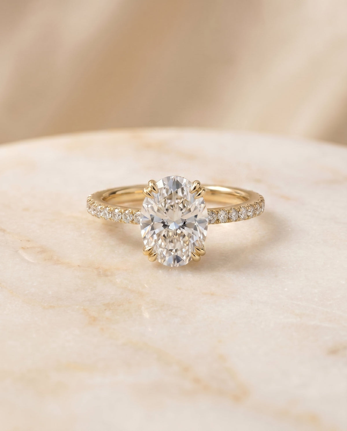 Kelly Select Pavé Oval Lab Diamond Engagement Ring in 18K Yellow Gold, shown on hand, angled | RockHer