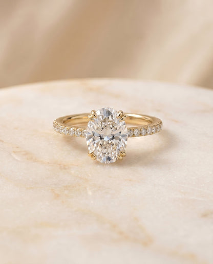 Kelly Select Pavé Oval Lab Diamond Engagement Ring in 18K Yellow Gold, shown on hand, angled | RockHer