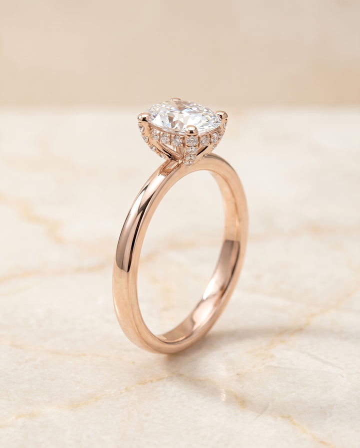 The Lana Secret Halo Adorned Prong Solitaire Oval Engagement Ring Setting in 14K Rose Gold