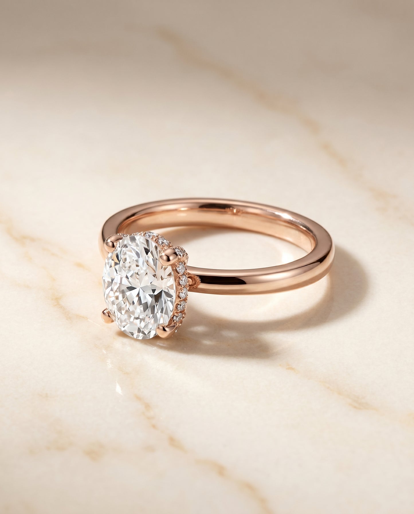 The Lana Secret Halo Adorned Prong Solitaire Oval Engagement Ring Setting in 14K Rose Gold