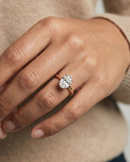 The Lana Secret Halo Adorned Prong Solitaire Oval Engagement Ring Setting in 14K Rose Gold