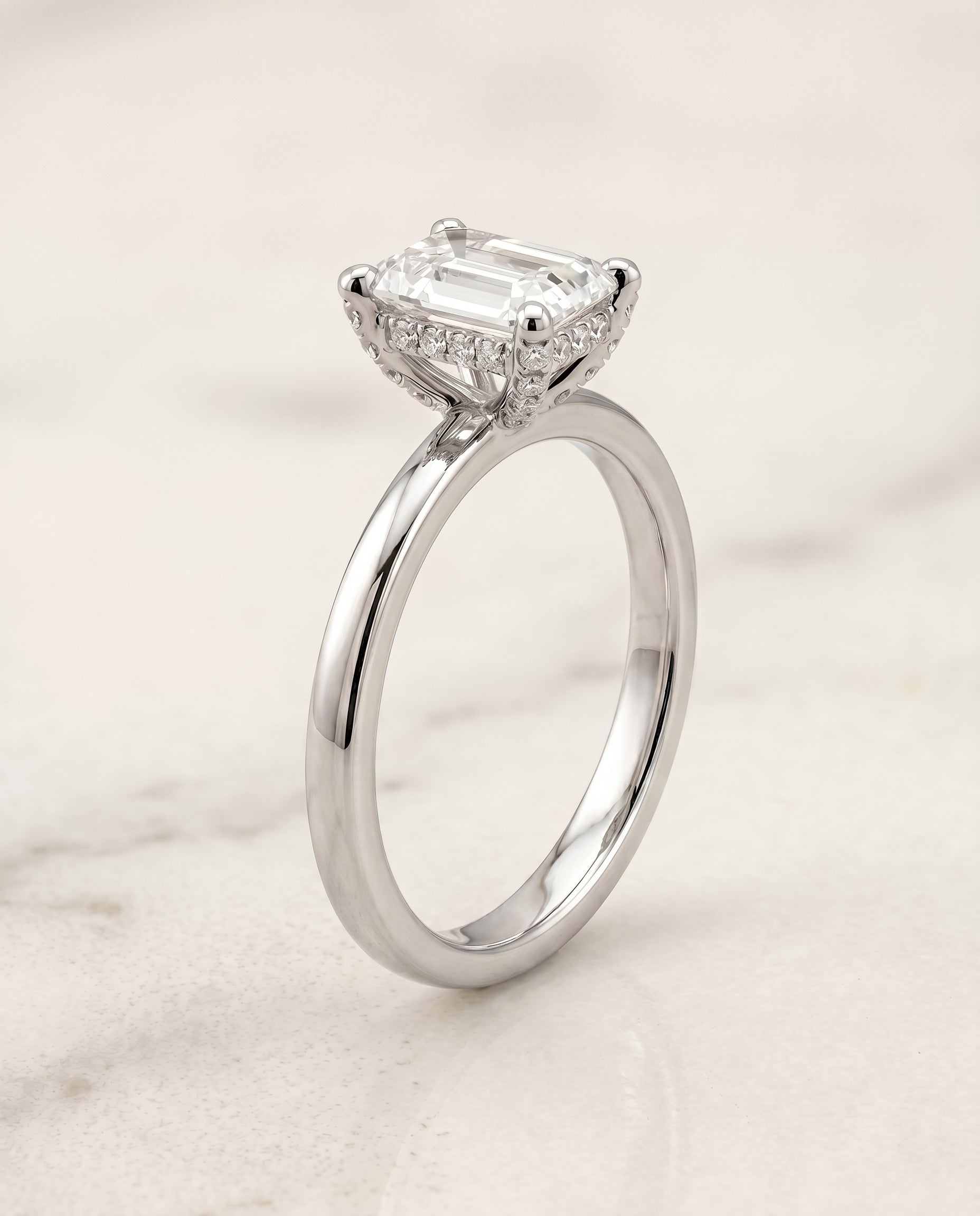 Secret Halo Adorned Prong Solitaire Cut styling on The Lana emerald engagement ring setting | RockHer
