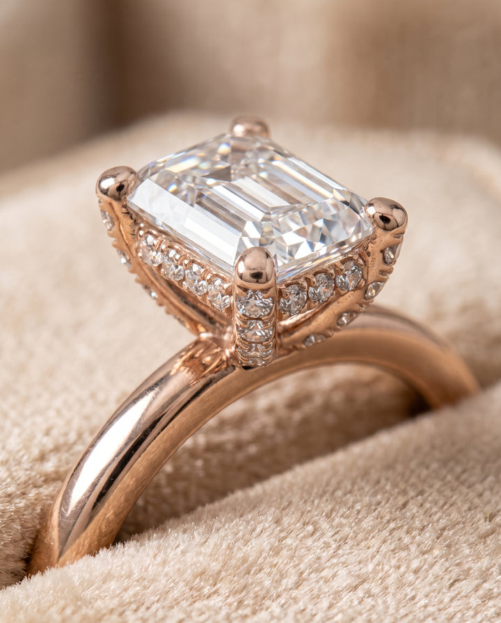 The Lana Secret Halo Adorned Prong Solitaire Emerald Cut Engagement Ring Setting in 14K Rose Gold