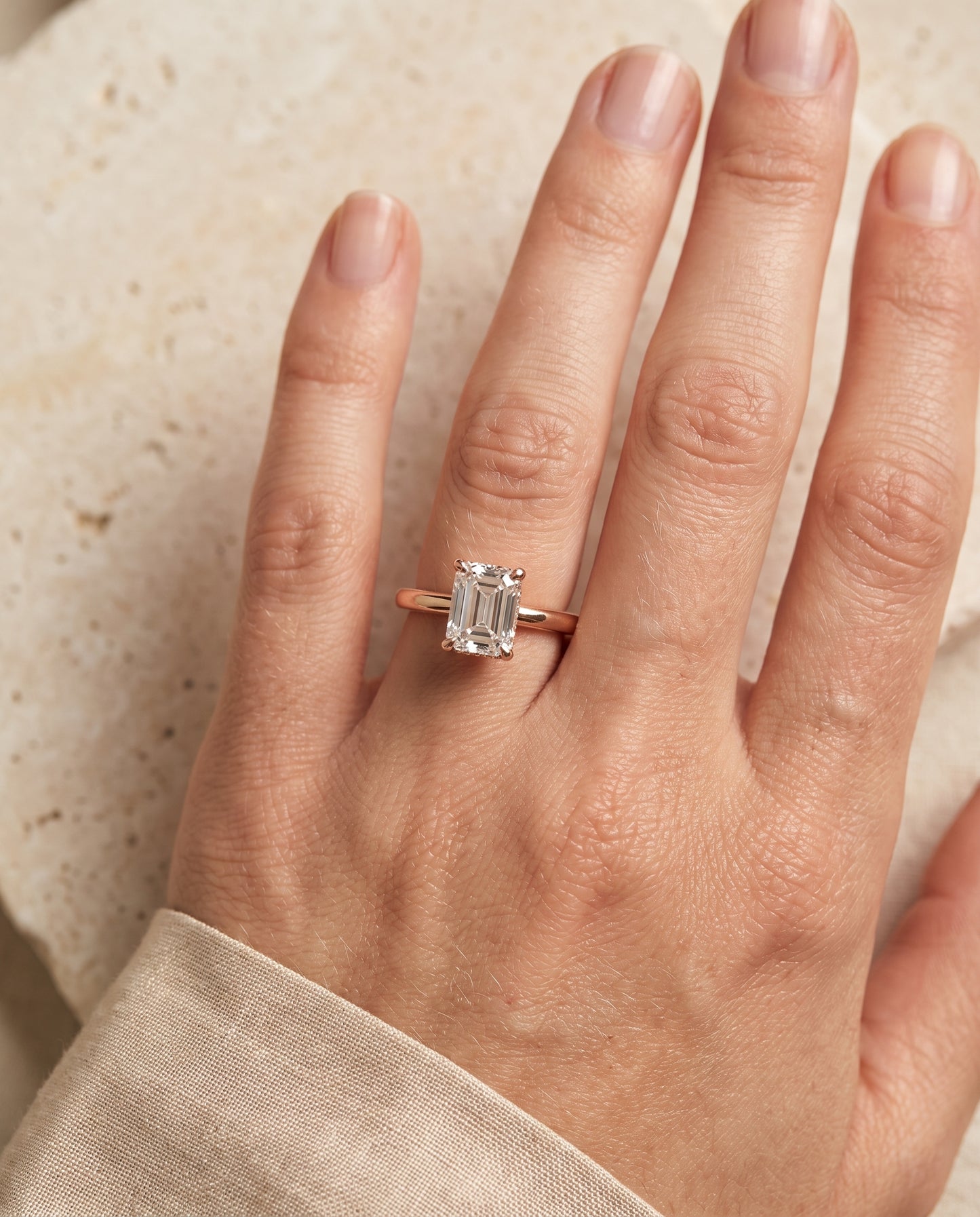 The Lana Secret Halo Adorned Prong Solitaire Emerald Cut Engagement Ring Setting in 14K Rose Gold