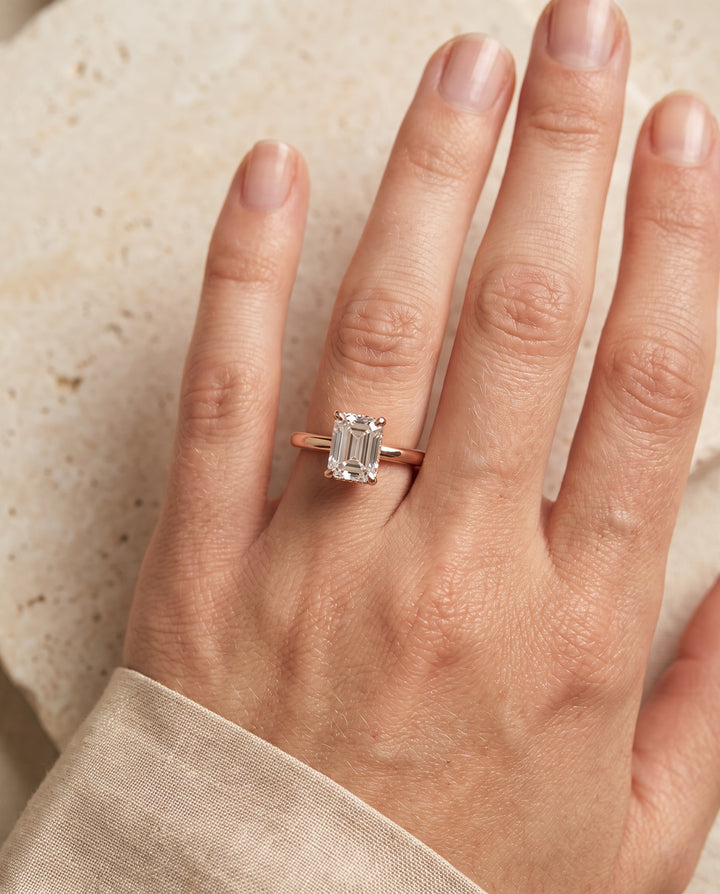 The Lana Secret Halo Adorned Prong Solitaire Emerald Cut Engagement Ring Setting in 14K Rose Gold