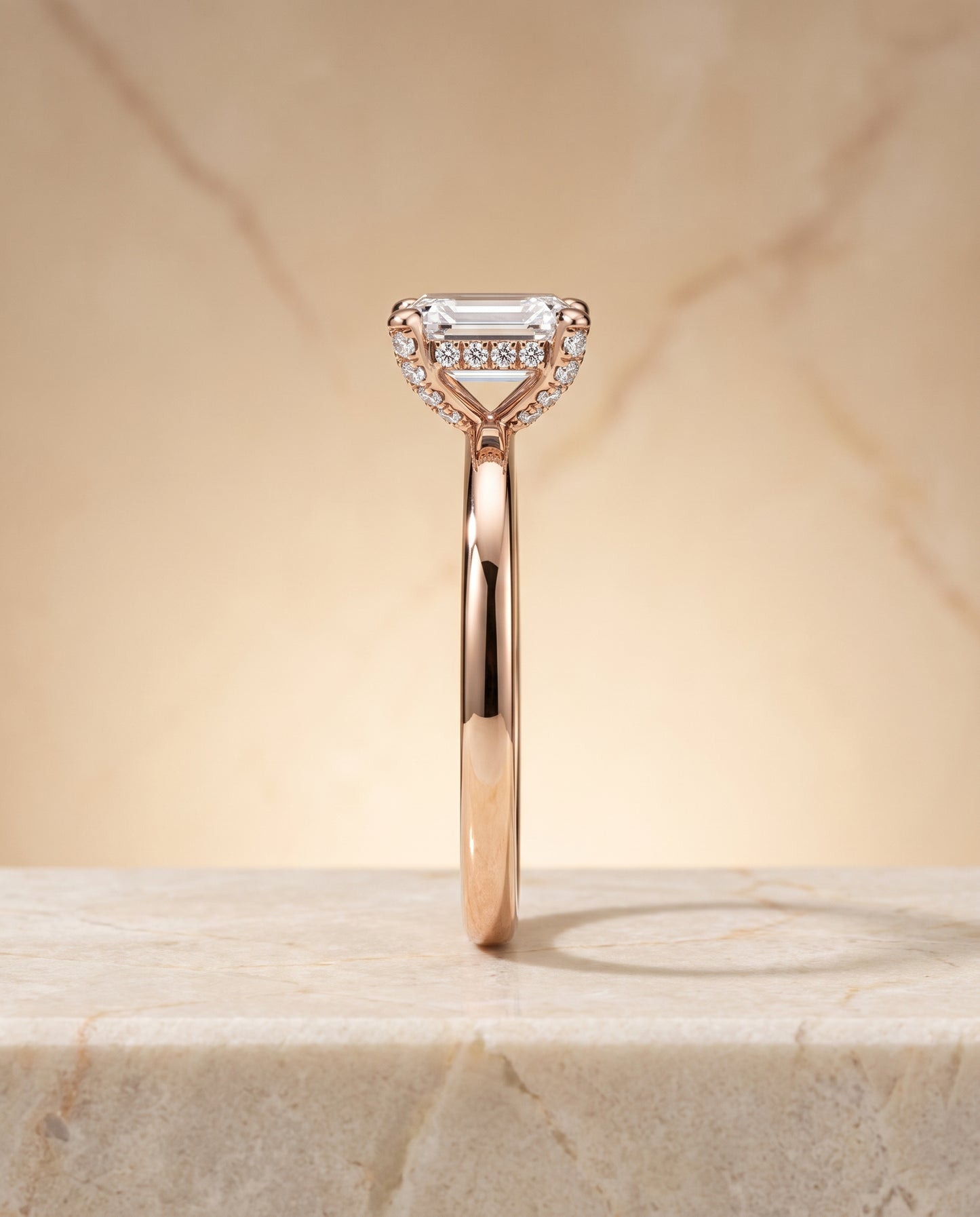 The Lana Secret Halo Adorned Prong Solitaire Emerald Cut Engagement Ring Setting in 14K Rose Gold