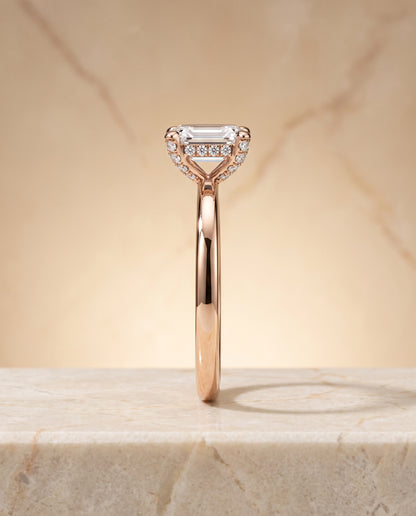 The Lana Secret Halo Adorned Prong Solitaire Emerald Cut Engagement Ring Setting in 14K Rose Gold