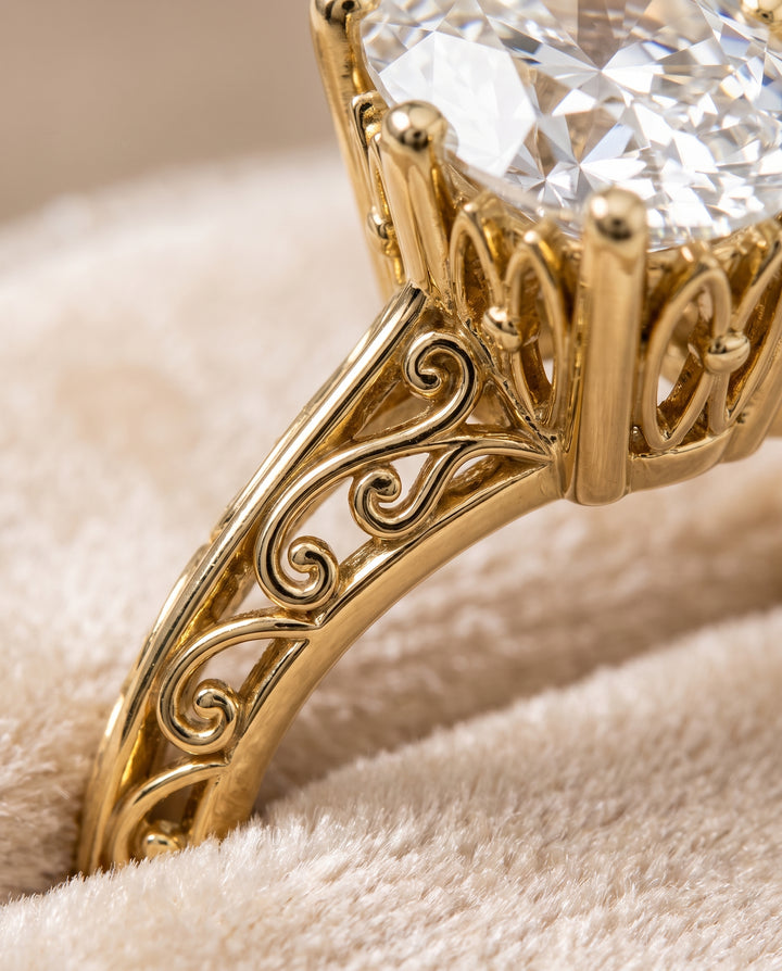 The Layla Vintage Scroll Cutout Solitaire Oval Engagement Ring Setting in 18K Yellow Gold