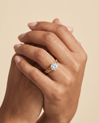 The Layla Vintage Scroll Cutout Solitaire Round Engagement Ring Setting in 18K Yellow Gold