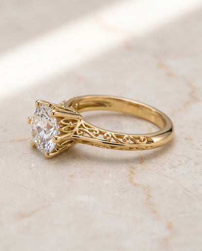 The Layla Vintage Scroll Cutout Solitaire Round Engagement Ring Setting in 18K Yellow Gold