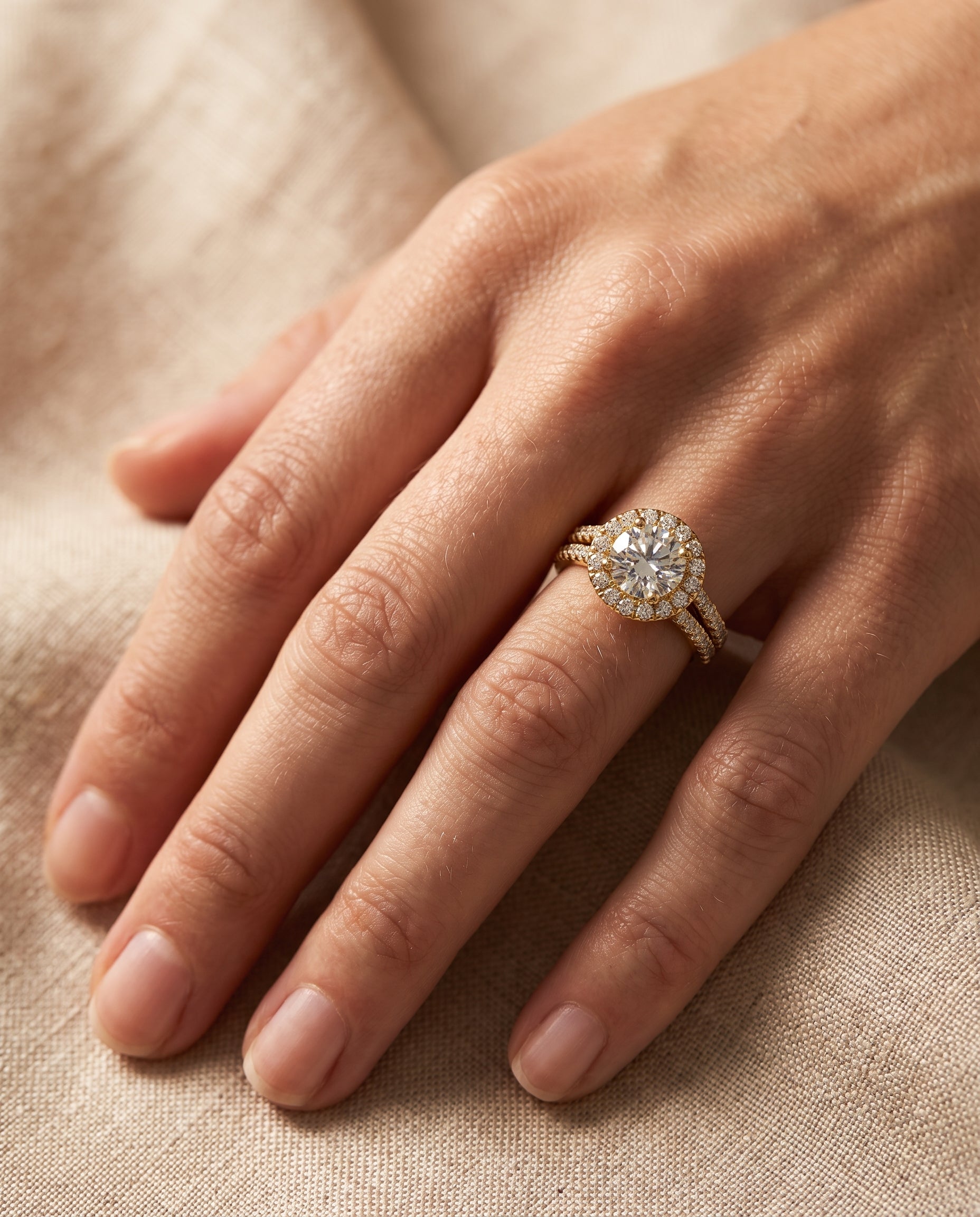 The Lira engagement ring setting in 18K Yellow Gold, french pavé split shank halo design | RockHer