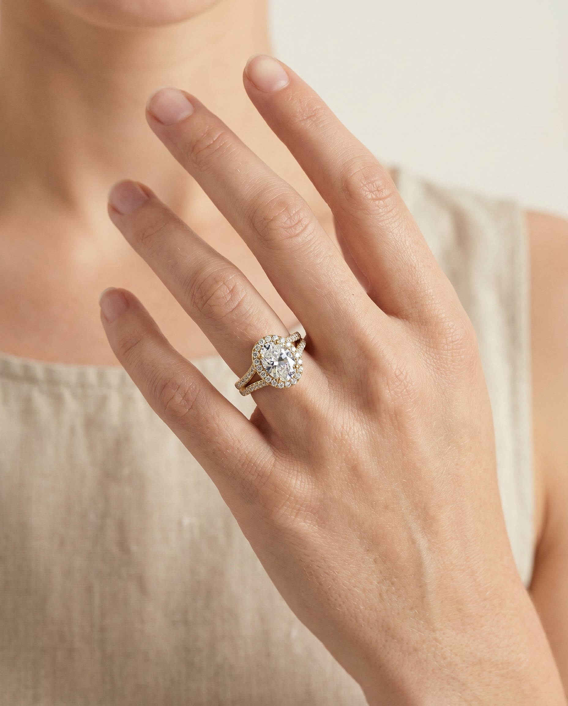 The Lira engagement ring setting in 18K Yellow Gold, french pavé split shank halo design | RockHer