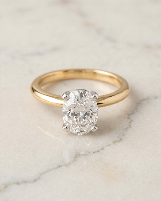 The Lolette Solitaire Engagement Ring Setting for Oval Diamonds in 18K Yellow Gold