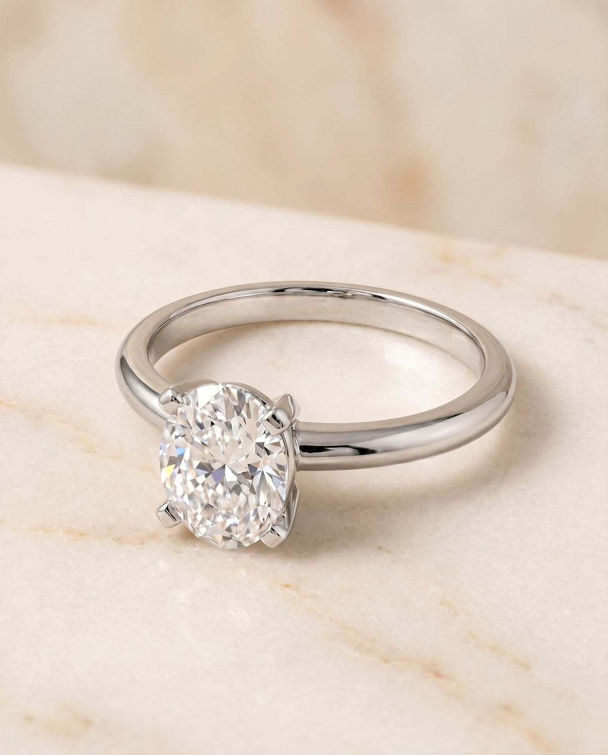Lolette Select Solitaire Oval Lab Diamond Engagement Ring in Platinum, shown on hand, angled | RockHer