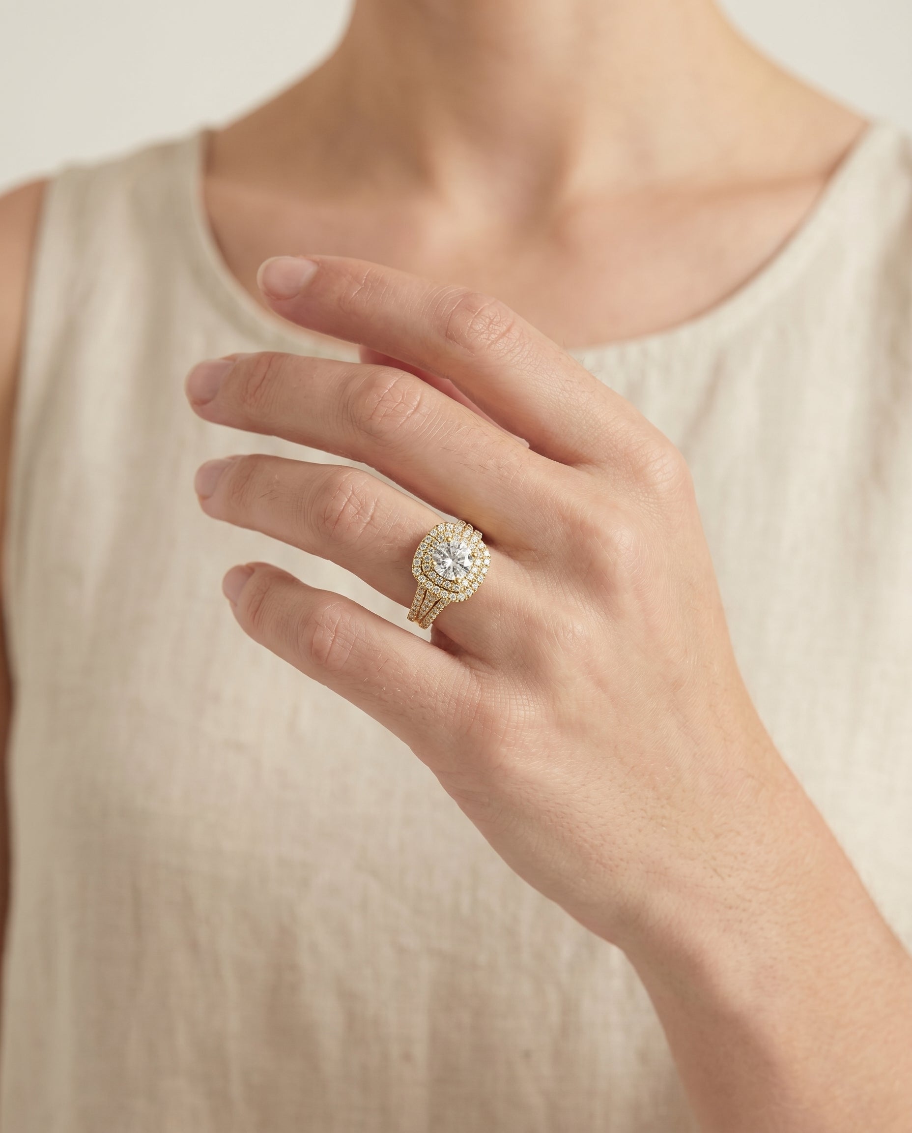 Lyra Select Double Halo Round Lab Diamond Engagement Ring in 18K Yellow Gold, shown on hand | RockHer