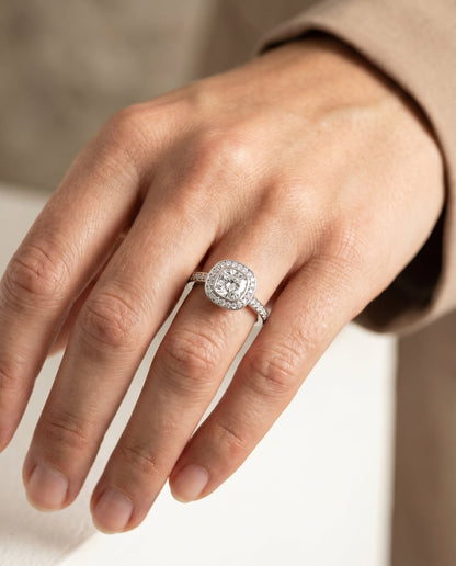 Marcia Select Bezel Halo Channel Band Cushion Cut Lab Diamond Engagement Ring in Platinum, shown on hand, angled | RockHer