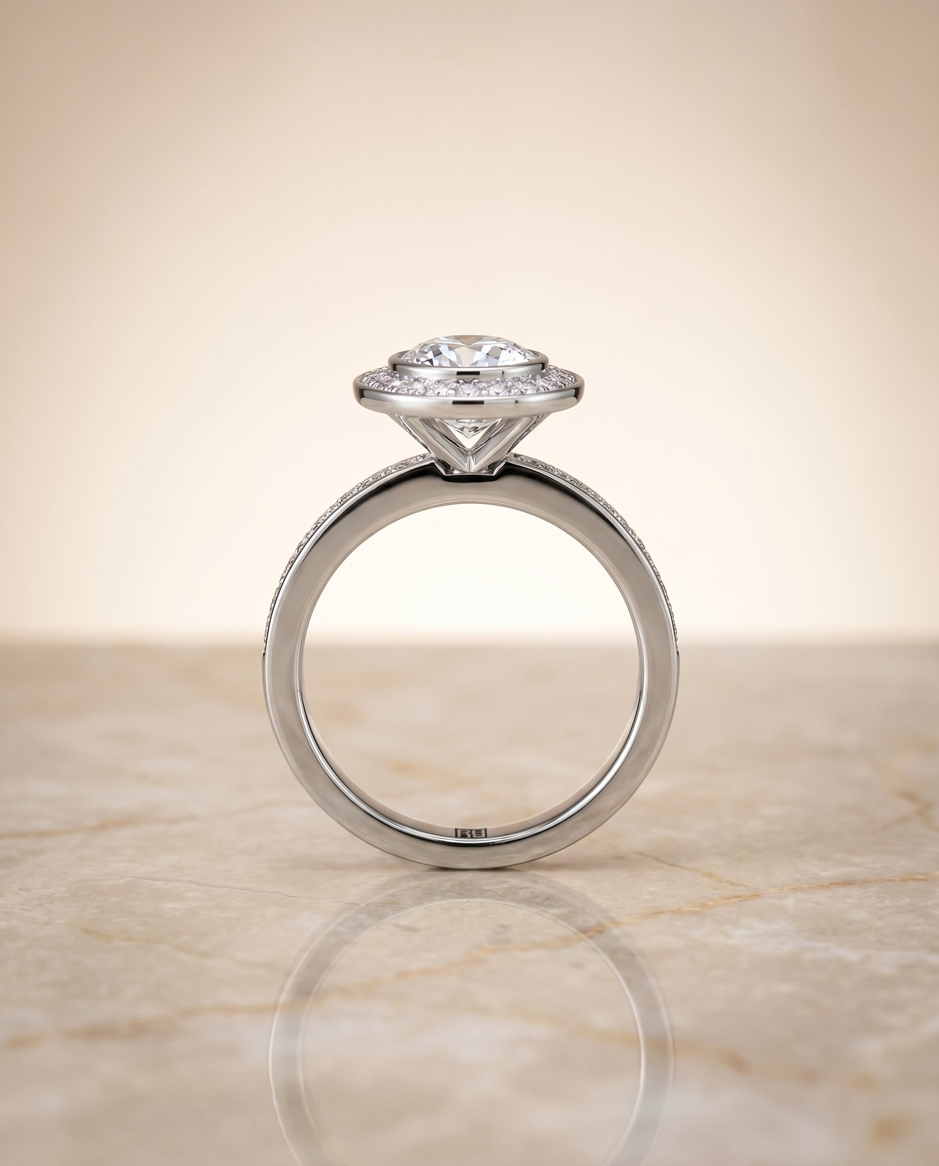 The Marcia bezel halo channel band cut engagement ring setting, shown in Platinum | RockHer