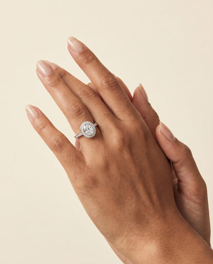The Marcia Bezel Halo Channel Band Oval Engagement Ring Setting in 18K White Gold