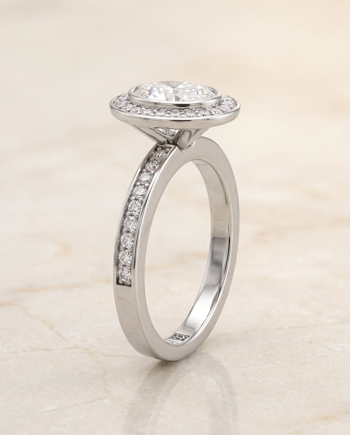 The Marcia Bezel Halo Channel Band Oval Engagement Ring Setting in 18K White Gold