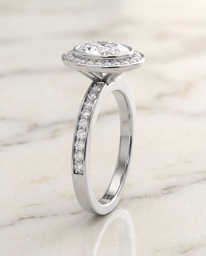 The Marcia Bezel Halo Channel Band Oval Engagement Ring Setting in 18K White Gold
